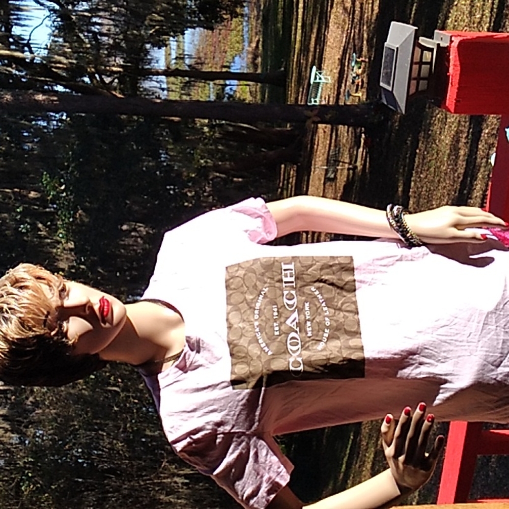 Pink Coach Shirt in an XS with tan logo on the front!